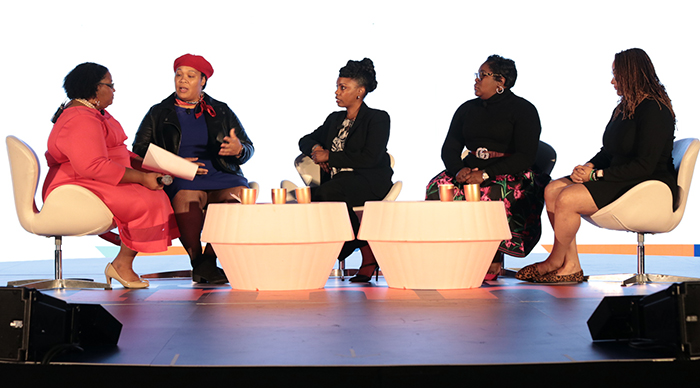 Speakers at a panel during the 2019 Houston summit.